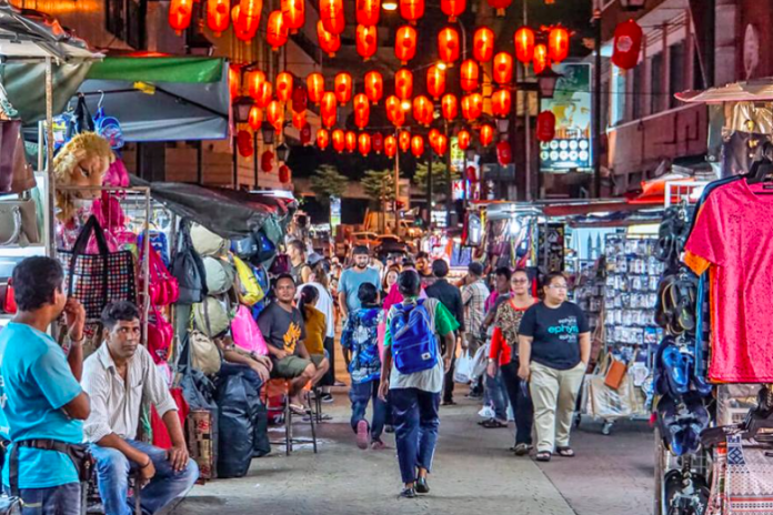 The bustling Petaling Street, Kuala Lumpur that sees the arrival of tourists after April 1, 2022. Today Bank Negara announces an increment in OPR.